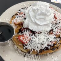 Chocolate and Strawberry waffle with coconut whipped cream 😍  at Donut Villa Diner in Malden