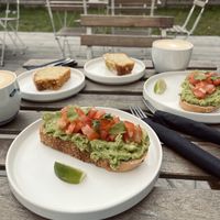 vegan avocado toast, vegan lemon cake and cappuccino with oat milk  at Twenty Twenty Coffee in Hvide Sande