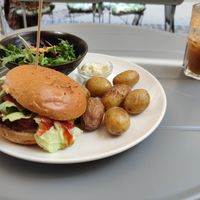 Cheese burger with potatoes, salad and mayo and an apple juice at Seed in Luxembourg City