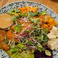 Bowl with schnizel added on top at Seed in Luxembourg City