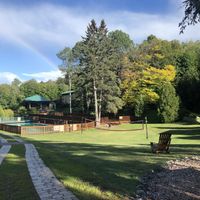 Pool and volleyball field at Sivananda Ashram Yoga Camp in Val-morin