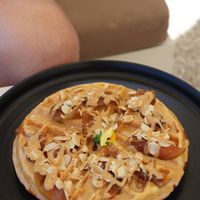 Waffle with peanut butter, maple syrup and caramelized apples 🍎  at Fotis All Day Bar in Naoussa
