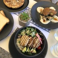 Vegan toast, waffle falafel bowl, and mushrooms on houmous  at Fotis All Day Bar in Naoussa