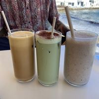 Iced latte, iced matcha latte and smoothie with pb, banana, dates, vegan protein powder and almond milk   at Fotis All Day Bar in Naoussa