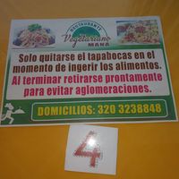 Sign on table at Restaurante Vegetariano Maná - La Pamba in Popayan