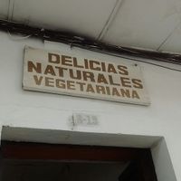 Outdoor sign at Delicias Naturales in Popayan