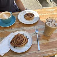 Cinnamon buns and coffee - you can take the food downstairs and eat outside if you want  at Café Mellemfolk in Aarhus