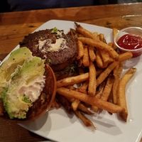 Beyond Burger with avocado, vegan aoili and house fries. at Cafe Nola in Frederick