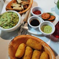 Fresh bread sticks mozzarella stick home made pickle and sauces and guacamole at NA NA  in Playa Del Carmen