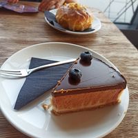 Vanilla tofu cheesecake (one of many variations) and a vegan donut at Bread House in Torun