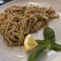 Tagliatelle integrali con pesto e lime   at Pizzaria Peperetta Dispetusa in Imperia