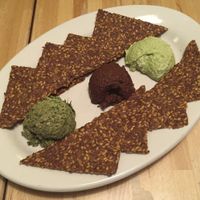 Trio Sampler @Ecopolitan. Pesto, Hummus and olive tapenade with flax crackers at Ecopolitan in Minneapolis