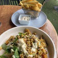 Pumpkin, spinach, quinoa, macadamia salad with side of chips and vegan aioli  at Cafe Melzar in Mount Gambier