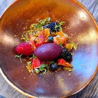 Dessert of red fruit an cherry sorbet with pistachio at Bosq in Den Hoorn Texel