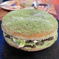 Stuffed matcha donut filled with adzuki beans and vegan cream. at Hatena in Tokyo