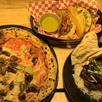 Pizza, tacos y tikka masala  at Plant Base in Lisbon
