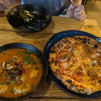 Momo and pizza at Plant Base in Lisbon