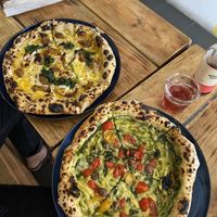 Pesto Pizza & Pizza with beyond meat sausage at Plant Base in Lisbon