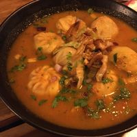 Momos (dumplings) in curry spicy sauce at Plant Base in Lisbon