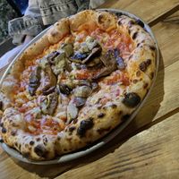 Flat and greasy pizza  at Plant Base in Lisbon