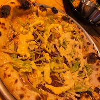 Pizza with cheddar cheese and beyond meat. at Plant Base in Lisbon