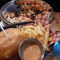 Classic burger and Pizza at Plant Base in Lisbon