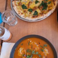 Curry momos and pizza at Plant Base in Lisbon