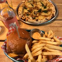 Classic burger and patata and salsiccia pizza  at Plant Base in Lisbon