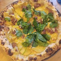 Pizza with potato and sausage at Plant Base in Lisbon