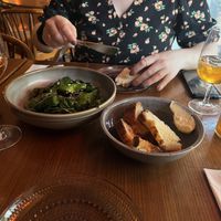Padrón peppers and bread. I had a glass of some amazing orange wine.  at Metro in Malmo