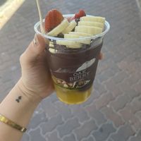 Mango purée, banana, strawberry, and vegan granola  at Oakberry in Bondi Beach