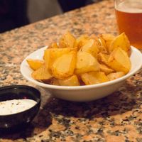 Fried cubed potatoes with a garlic sauce at Cat Bar in Barcelona
