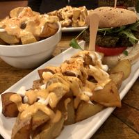 Champion Burger with Extra Bravas!  at Cat Bar in Barcelona