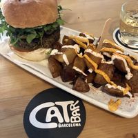 Champion, Bravas and a Glass of Wine!  at Cat Bar in Barcelona