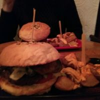 Black Cat burger with potato wedges and vegannaise. at Cat Bar in Barcelona