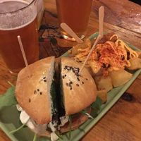 Green burger with patatas bravas at Cat Bar in Barcelona