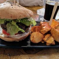 Black Cat burger and patatas bravas at Cat Bar in Barcelona