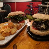 Champion + fries and black cat. at Cat Bar in Barcelona