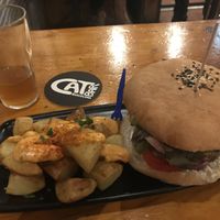 Burger and roast potatoes at Cat Bar in Barcelona