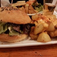Black cat burger and bravas at Cat Bar in Barcelona