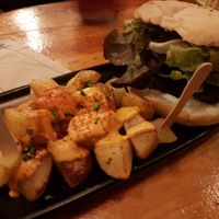 Black cat and bravas at Cat Bar in Barcelona