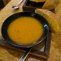 Tasty pumpkin soup with a chunk of fresh bread at Terre Mere in Liege