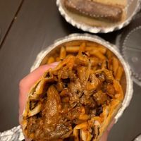 Edge Veggie Burrito with oyster mushroom pulled pork, vegan cheese, caramelized onions, black beans, & bbq sauce. In the back are the Cajun fries (cooked in a shared fryer) &hotdog at Big Belly Que in Smithtown