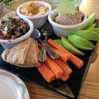 House-made vegan cheeses
served with w/sliced apples & veggies    at Lotus Cafe in Panama City Beach