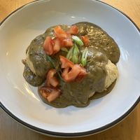 Vegan Biscuits & Gravy. Homemade vegan biscuits topped with mushroom gravy, tomatoes & scallions. at Seward Cafe in Minneapolis
