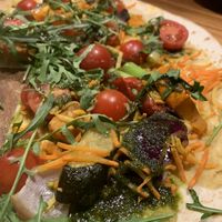 Nice, affordable restaurant, multiple vegan options for starters and mains. This vegan pizza was most delicious, with various vegetables and pesto.   at S'Wirtshaus in Saalbach