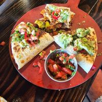 Habinero Enchiladas with guacamole at Centro Neighborhood Kitchen in Burien