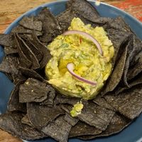 Black nachos with home made guacamole at Fresh Green in San Sebastian