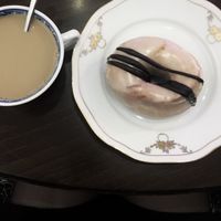 Peanut butter and chocolate glazed doughnut and coffee at Round & Square in Helsinki