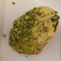 Pistachio and mango doughnut 🍩   at Round & Square in Helsinki